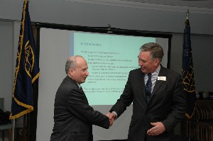 John Kirby (r), chapter president, thanks Stubbings for speaking at the February meeting.